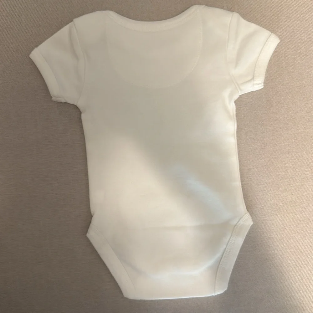 Pact newborn onesie